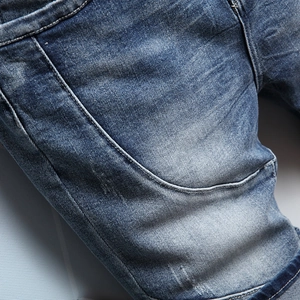 Slim fit blue denim jeans for men with vintage washed finish and distressed stitching