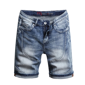 Men's light blue washed denim shorts with curved seam stitching and cuffed hem detail