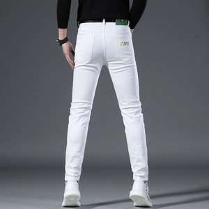 Rear view of white slim fit men's jeans featuring CNC gold embroidery on back pocket