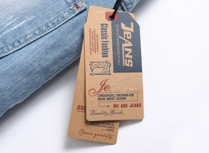 Detailed macro view of light blue denim fabric texture with vintage kraft paper tags