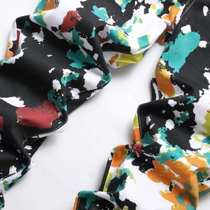 Men's slim fit skinny jeans featuring colorful abstract graffiti paint splatter print