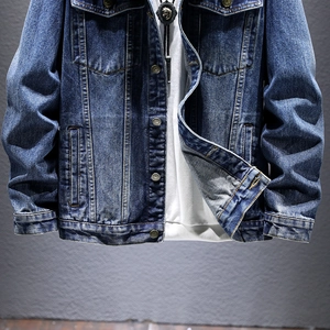 Classic blue denim jacket for men in loose fit with washed finish and metal buttons