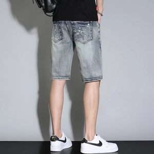 Men's retro blue denim shorts with distressed wash and white splatter paint details