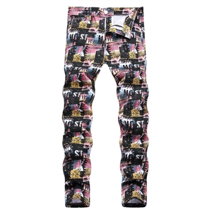Men's slim fit jeans with colorful abstract graffiti print and white ST lettering