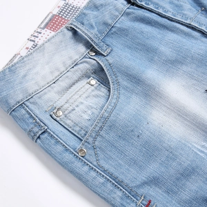 Men's light blue ripped denim shorts featuring American star pattern inner lining