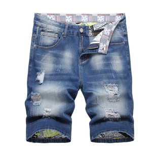 Men's slim fit distressed denim shorts with ripped details in light blue wash