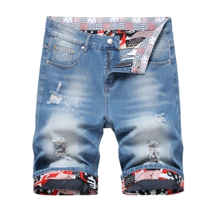 Distressed light blue denim shorts for men with paint splatters and stars and stripes trim