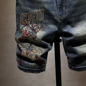 Blue denim shorts for men with detailed koi fish and CKU letter embroidery on wash fabric