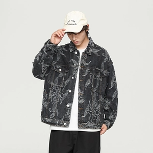 Detailed view of dark grey denim jacket featuring intricate white floral line embroidery