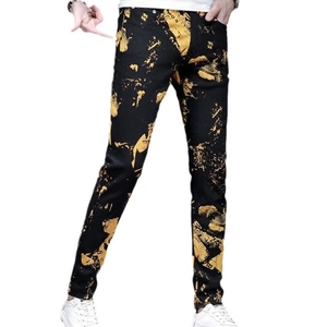 Slim fit men's black jeans with artistic yellow splash print on white background