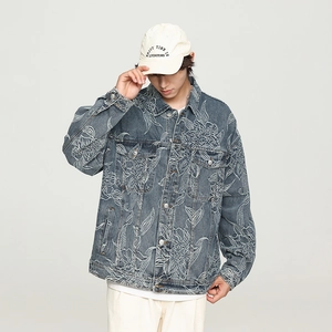 Men's slim fit blue denim jacket featuring all-over white embroidery and lapel collar