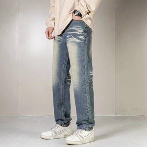 Men's vintage blue straight-leg jeans with faded whiskers and casual streetwear style