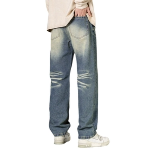 Men's retro blue straight leg jeans with vintage wash and whiskers on heavy denim