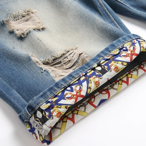 Men's slim-fit ripped denim shorts with vintage chain print inner cuffs and distressed detail