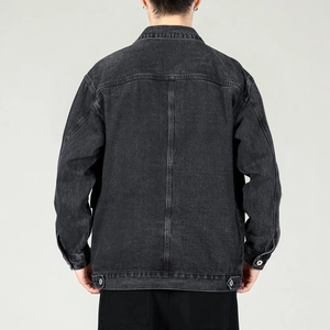 Rear view of men's washed black denim jacket with adjustable waist and classic seams