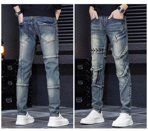 Detail view of mens patchwork ripped jeans with criss-cross lacing and distressed texture