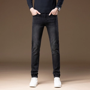 Slim fit dark grey stretch denim jeans for men featuring natural faded thighs and urban style