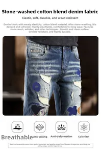 Detail of ripped blue jeans showing stone wash, distressed holes and blue fabric patches