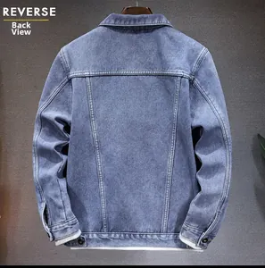 Detail view of the back of a light blue washed denim jacket with premium stitching