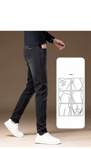 Detail of men's slim fit black denim trousers featuring 3D cut for a slimming effect