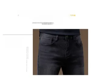 Detail of dark grey slim jeans showing high-quality waist stitching and zip fly closure