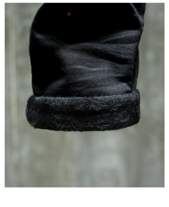 Macro detail of men's slim fit black jeans featuring thick thermal fleece lining inside