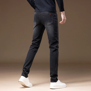 Slim fit dark grey fleece-lined jeans for men with washed effect and red pocket label