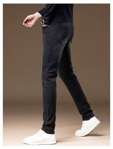Rear view of slim fit black denim pants showing high-quality stretch fabric and tailoring