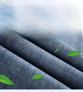 Macro shot of high-quality light blue denim fabric showing soft texture and vertical creases
