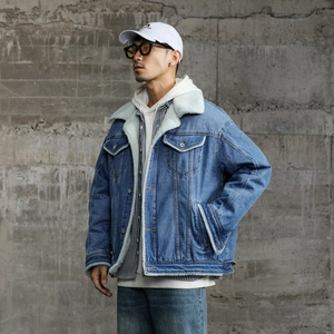 Men's blue sherpa lined denim jacket with warm white faux fleece collar and heavy cotton fabric