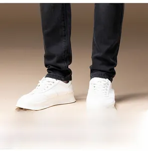 Detailed view of the neat stitching and hem on black slim-fit fleece-lined jeans