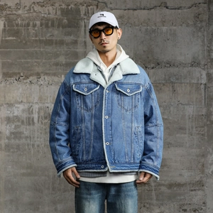 Men's blue denim jacket with warm white fleece lining and layered streetwear styling