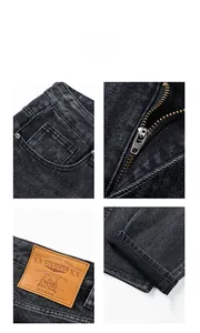 Vista dettagliata del denim nero lavato, cerniera YKK e toppa in pelle in vita