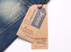 Detail of vintage blue denim shorts with distressed texture and retro brand tags