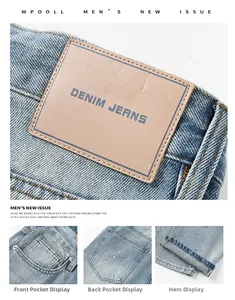 Detailansicht hellblaue Jeans mit Lederetikett und Farbspritzer-Effekt für modebewusste Männer