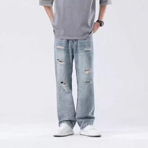 Men's light blue distressed loose straight-leg jeans with ripped knees and washed finish