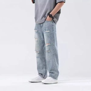 Men's light blue washed distressed jeans in a loose straight fit for casual fashion