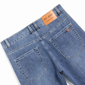 Classic light blue slim fit denim jeans for men with back leather patch detail