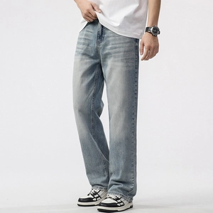 Men's loose straight leg light blue washed denim jeans with casual vintage fade effects