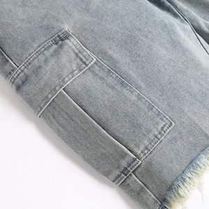 Men's light blue cargo denim shorts with utility pockets and frayed raw hem detail