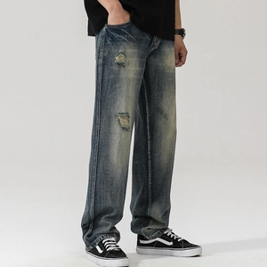Jean homme vintage délavé coupe droite ample avec détails déchirés et usés