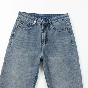 Men's light blue washed straight leg jeans with a white woven label on the waistband