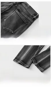 Detail der sternförmigen Gesäßtasche und des doppelt genähten Saums der grauen Jeans