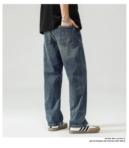Detailed back view of dark blue washed denim wide-leg pants featuring classic patch pockets