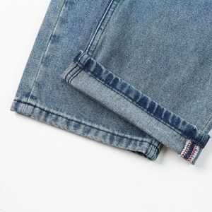 Men's loose light blue straight jeans featuring premium red selvedge denim cuff details