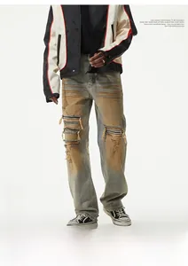 Detail of vintage washed denim jeans with distressed holes and striped inner patches