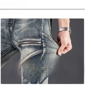 Close-up of high elasticity deep blue washed denim jeans with side zipper detail