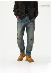 Close-up of vintage blue wash denim with large quilted utility pockets and metal loop