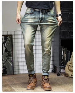 Close-up of vintage wash slim fit jeans showing superior stretch fabric and texture