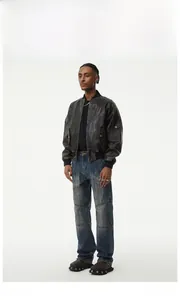 Detailed view of men's vintage street style distressed denim pants with patchwork design